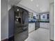 Modern kitchen with stainless steel appliances and white cabinets at 5400 Roswell Rd # P2, Atlanta, GA 30342