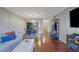 Open concept living room with hardwood floors, showing the dining area and kitchen at 5400 Roswell Rd # P2, Atlanta, GA 30342