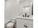 Bathroom with white subway tile, marble vanity, and toilet at 628 Robinson Se Ave # B, Atlanta, GA 30312