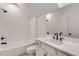 Bathroom with white subway tile, marble vanity, and bathtub at 628 Robinson Se Ave # B, Atlanta, GA 30312