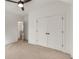 Bedroom with double doors, carpet, and access to upper hallway at 628 Robinson Se Ave # B, Atlanta, GA 30312
