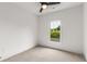 Bright bedroom with carpeted floor, large window, and ceiling fan at 628 Robinson Se Ave # B, Atlanta, GA 30312