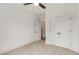 Bedroom with ceiling fan, carpet, and double doors at 628 Robinson Se Ave # B, Atlanta, GA 30312