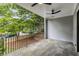 Covered porch with tile flooring and ceiling fan, overlooking a tree-lined street at 628 Robinson Se Ave # B, Atlanta, GA 30312