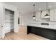 Kitchen with white cabinets, marble island, and pantry at 628 Robinson Se Ave # B, Atlanta, GA 30312