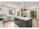 Modern kitchen with white cabinets, marble island, and gas range at 628 Robinson Se Ave # B, Atlanta, GA 30312