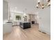 Open concept kitchen with island and view into living room at 628 Robinson Se Ave # B, Atlanta, GA 30312