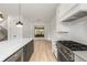 Open concept kitchen island with marble top and stainless steel appliances at 628 Robinson Se Ave # A, Atlanta, GA 30312