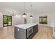 Modern kitchen with large island and hardwood floors at 628 Robinson Se Ave # B, Atlanta, GA 30312