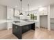 Spacious kitchen with white cabinets, marble countertops, and island at 628 Robinson Se Ave # B, Atlanta, GA 30312