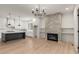 Open living space with kitchen island, fireplace, and hardwood floors at 628 Robinson Se Ave # B, Atlanta, GA 30312