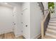 Modern staircase with light oak wood and black metal railing at 628 Robinson Se Ave # B, Atlanta, GA 30312