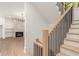 Elegant staircase with light wood and black metal railings at 628 Robinson Se Ave # A, Atlanta, GA 30312