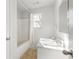 Clean bathroom with tub, shower and vanity at 2605 Poplar Ln, Cumming, GA 30041