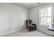 Cozy bedroom with recliner and large window at 2605 Poplar Ln, Cumming, GA 30041