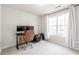 Bright bedroom with window, workspace and carpet flooring at 2605 Poplar Ln, Cumming, GA 30041