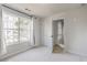 Well-lit bedroom with large window and closet at 2605 Poplar Ln, Cumming, GA 30041