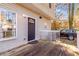 Wooden deck with access to backyard and parking area at 2605 Poplar Ln, Cumming, GA 30041