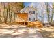 Two-story house with a large deck and screened porch at 2605 Poplar Ln, Cumming, GA 30041