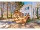 Two-story house with a large deck and screened porch at 2605 Poplar Ln, Cumming, GA 30041