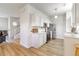 Kitchen with white cabinets, stainless steel appliances, and light flooring at 2605 Poplar Ln, Cumming, GA 30041