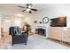 Bright living room with fireplace, hardwood floors, and comfortable seating at 2605 Poplar Ln, Cumming, GA 30041