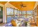 Relaxing screened porch with ceiling fan and sliding doors at 2605 Poplar Ln, Cumming, GA 30041