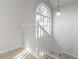 Bright staircase with white railing and carpet runner at 2605 Poplar Ln, Cumming, GA 30041