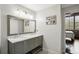 Bathroom with double vanity, marble countertop and large mirror at 3235 Roswell Ne Rd # 718, Atlanta, GA 30305