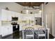 Modern kitchen with white cabinets, stainless steel appliances, and an island at 3235 Roswell Ne Rd # 718, Atlanta, GA 30305