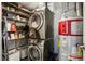Laundry area with washer, dryer, and storage shelves at 3235 Roswell Ne Rd # 718, Atlanta, GA 30305