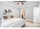 Main bedroom with ensuite bathroom and ceiling fan at 327 Brownstones Ne Cir, Atlanta, GA 30312