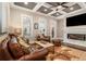 Living room with hardwood floors, fireplace, and coffered ceiling at 327 Brownstones Ne Cir, Atlanta, GA 30312