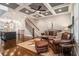 Open living area with hardwood floors, leather furniture, and a modern staircase at 327 Brownstones Ne Cir, Atlanta, GA 30312