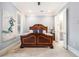 Main bedroom with ceiling fan, ensuite bath, and plenty of light at 327 Brownstones Ne Cir, Atlanta, GA 30312