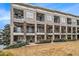 Side view of townhomes with landscaping and grassy area at 327 Brownstones Ne Cir, Atlanta, GA 30312