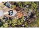 Aerial view of house and lot, wooded setting, near a pond at 55 Hastings Ln, Covington, GA 30014