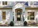 Inviting front entry with black door and lantern lights at 705 Old Post Rd, Atlanta, GA 30328