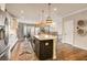 Modern kitchen with large island, stainless steel appliances, and hardwood floors at 1023 Brandsford Nw St, Atlanta, GA 30318