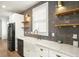 Modern kitchen features white cabinets, farmhouse sink, and quartz countertops at 729 Martin Se St, Atlanta, GA 30315