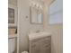 Clean bathroom with single vanity, updated fixtures, and a window at 8791 Daerwater Dr, Winston, GA 30187