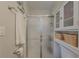 Simple bathroom with a shower, linen storage, and neutral tones at 8791 Daerwater Dr, Winston, GA 30187