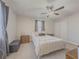 Spacious bedroom featuring a queen bed, ceiling fan, and ample closet space at 8791 Daerwater Dr, Winston, GA 30187