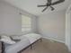 Small bedroom with twin bed, neutral walls, and window coverings at 8791 Daerwater Dr, Winston, GA 30187
