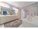 Elegant bathroom with double vanity, large soaking tub, and separate shower at 2040 Hickory Station Cir, Snellville, GA 30078
