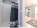 Shower stall with patterned curtain and view into another bathroom at 2040 Hickory Station Cir, Snellville, GA 30078