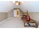 Bonus room with vaulted ceiling, ceiling fan, and plenty of natural light at 2040 Hickory Station Cir, Snellville, GA 30078