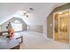 Large bonus room with vaulted ceiling, carpet, and plenty of natural light at 2040 Hickory Station Cir, Snellville, GA 30078