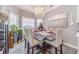 Elegant dining room with chandelier and seating for six at 2040 Hickory Station Cir, Snellville, GA 30078