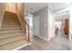 Bright entryway with staircase, wood-look flooring and views to other rooms at 2040 Hickory Station Cir, Snellville, GA 30078